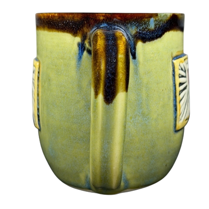 Alissa Clark Clayworks heart mug in green with textured side details and a unique shape