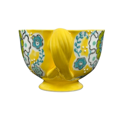 Anthropologie Elka Ayaka floral pedestal mug in glossy yellow with turquoise and green hand painted flowers