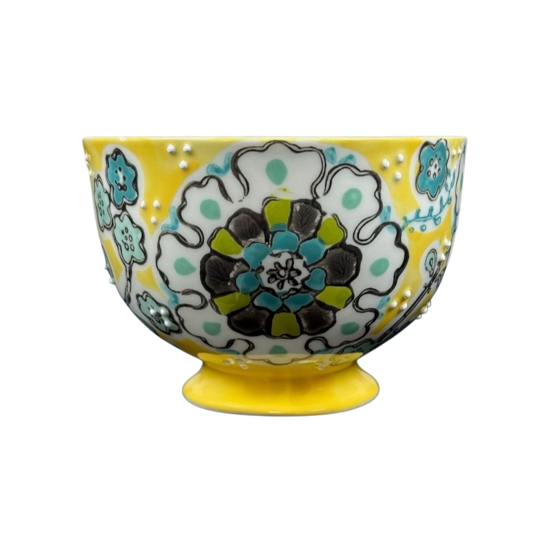 Anthropologie Elka Ayaka floral pedestal mug yellow hand painted ceramic mug with turquoise green floral design on pedestal base