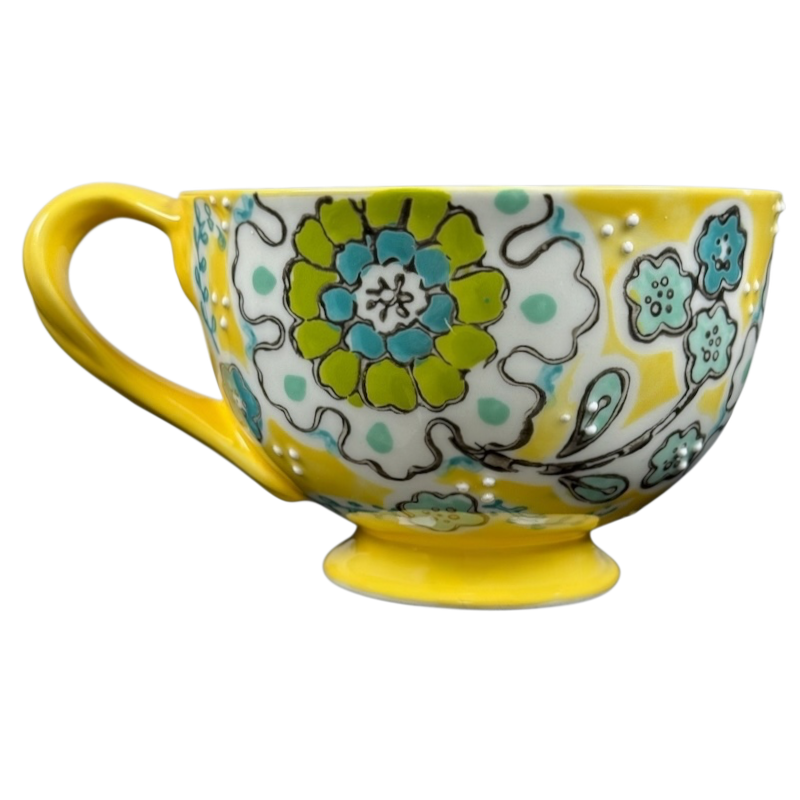 Anthropologie Elka Ayaka floral pedestal mug yellow ceramic cup with green blue floral pattern and handle