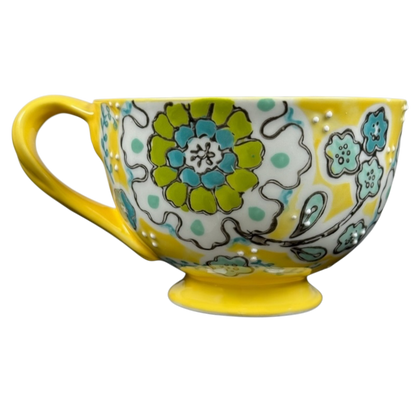 Anthropologie Elka Ayaka floral pedestal mug yellow ceramic cup with green blue floral pattern and handle