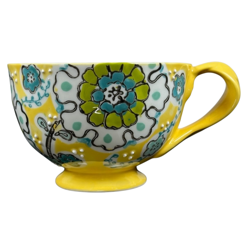 Anthropologie Elka Ayaka floral pedestal mug bright yellow ceramic with turquoise and green floral pattern and handle