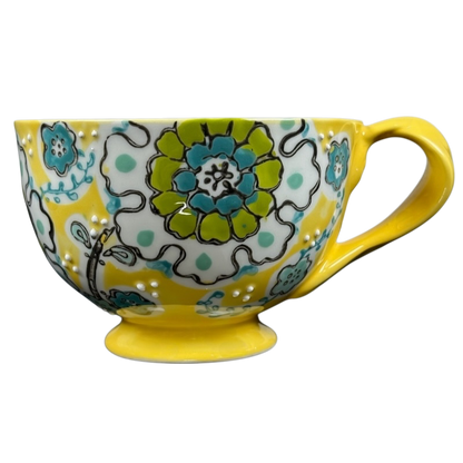 Anthropologie Elka Ayaka floral pedestal mug bright yellow ceramic with turquoise and green floral pattern and handle