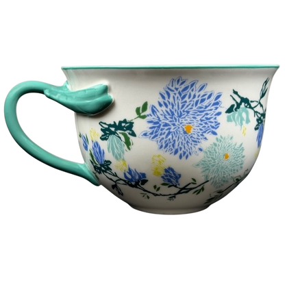 Arboretum Floral Teal Dragonfly Handle Mug Anthropologie with colorful floral design and teal dragonfly handle