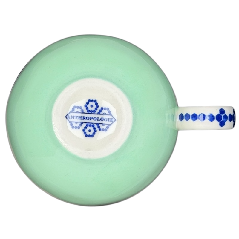 Top view of the Bonjour Pottery Bistro Mug Anthropologie featuring a light green finish and decorative patterns