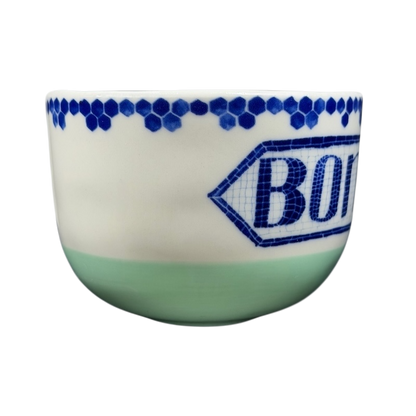Bonjour Pottery Bistro Mug Anthropologie with decorative blue patterns and green base for stylish coffee enjoyment