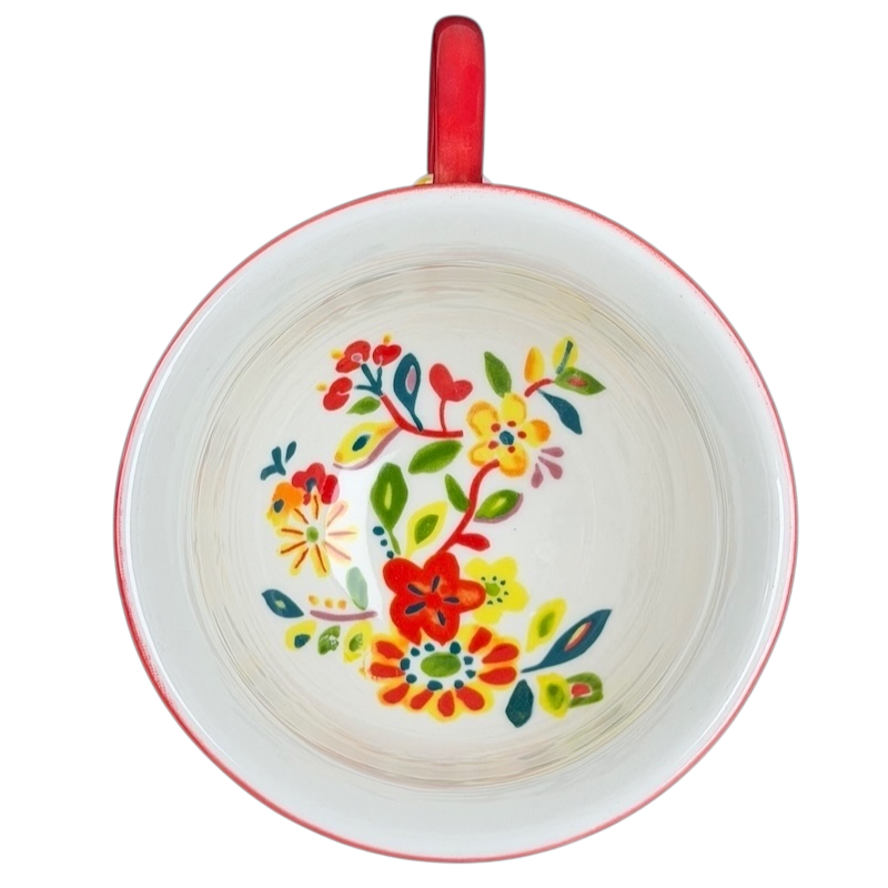 Top view of Cadiz Floral Mug Anthropologie featuring vibrant floral patterns on a white background