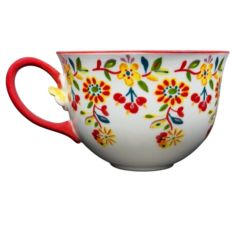 Cadiz Floral Mug Anthropologie featuring vibrant floral patterns and a red handle for colorful dining