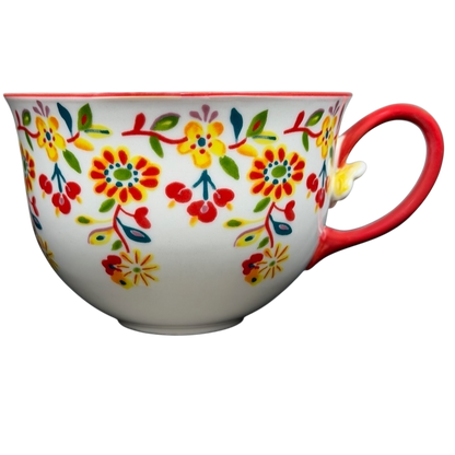 Cadiz Floral Mug Anthropologie featuring vibrant floral patterns and a red handle for a cheerful drinkware choice