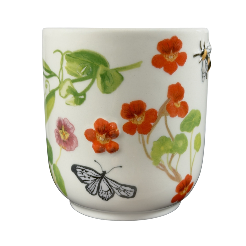 Collectible monogram mug Anthropologie featuring colorful flowers and butterflies design