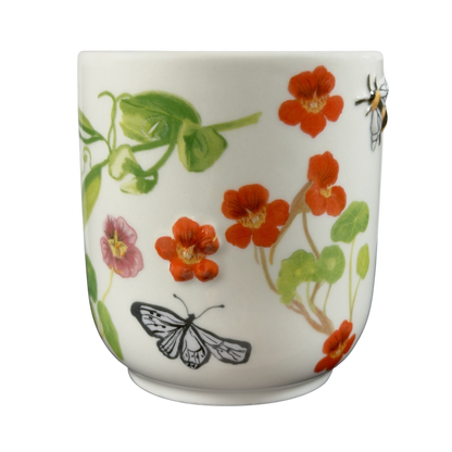 Collectible monogram mug Anthropologie featuring colorful flowers and butterflies design