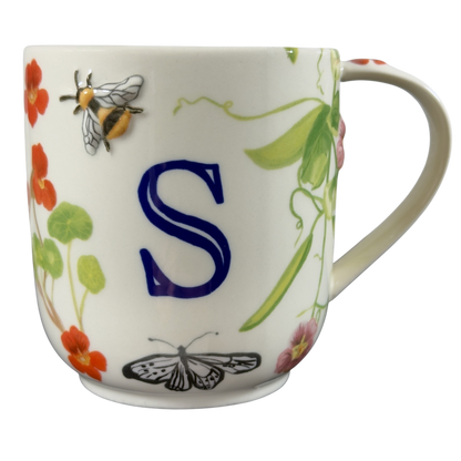 Collectible monogram mug Anthropologie featuring an elegant S design with floral and bee accents