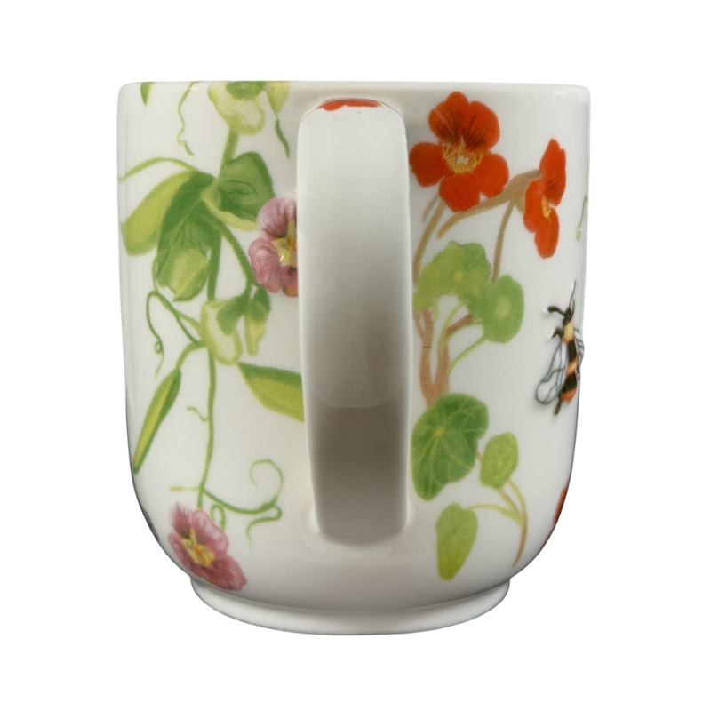 Collectible monogram mug Anthropologie with colorful floral design and bee details