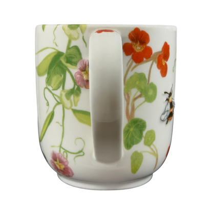 Collectible monogram mug Anthropologie with colorful floral design and bee details