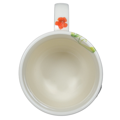 Collectible monogram mug Anthropologie with floral design and white glossy finish
