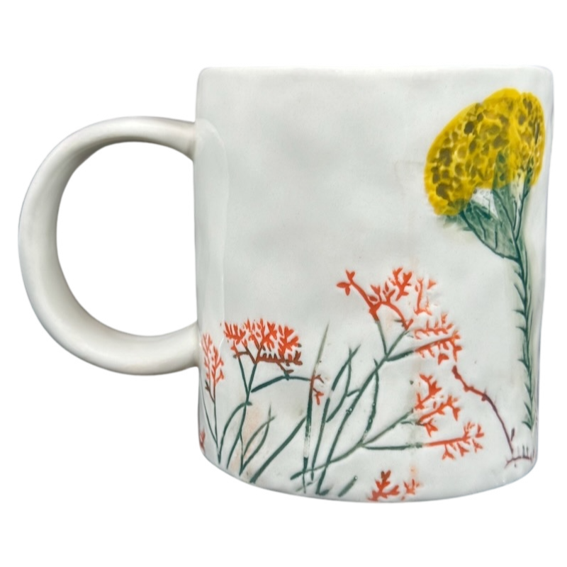 Anthropologie Dagny T monogram initial mug with colorful floral design and sturdy handle