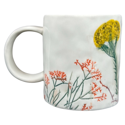 Anthropologie Dagny T monogram initial mug with colorful floral design and sturdy handle