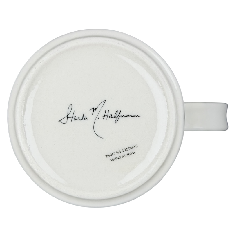 Bottom view of Anthropologie J monogram Starla Halfmann mug showcasing signature and ceramic finish