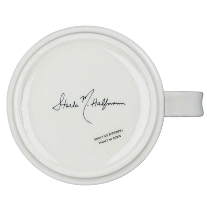 Bottom view of Anthropologie J monogram Starla Halfmann mug showcasing signature and ceramic finish