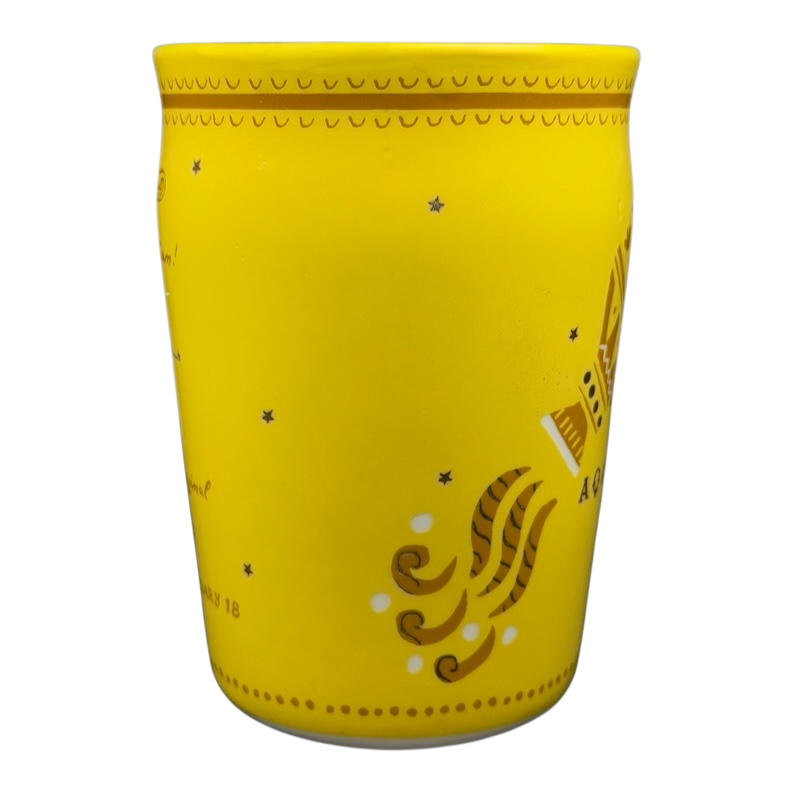 AQUARIUS Danielle Kroll Astrology Mug Anthropologie in bright yellow with decorative design