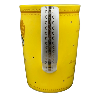 AQUARIUS Danielle Kroll Astrology Mug Anthropologie in bright yellow with a decorative handle