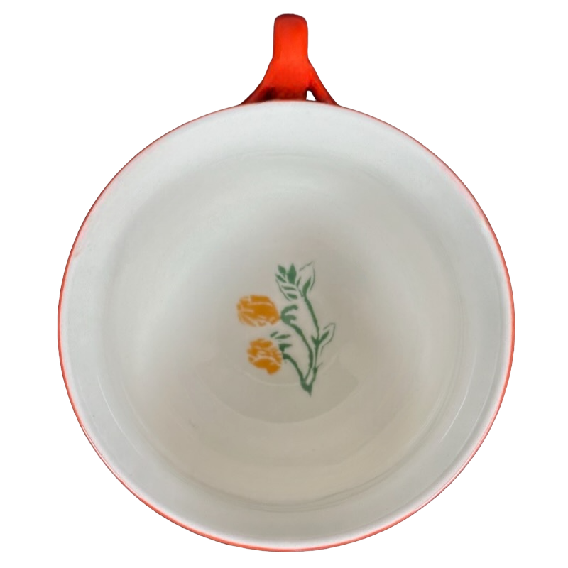 Arboretum Floral Orange Dragonfly Handle Mug Anthropologie with a floral design on the interior