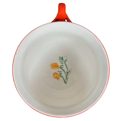 Arboretum Floral Orange Dragonfly Handle Mug Anthropologie with a floral design on the interior