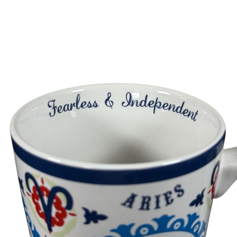 Aries zodiac Fisher mug with fearless and independent text and decorative blue and red design