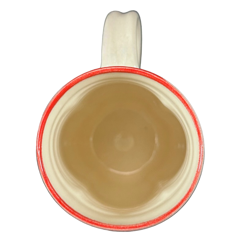 Top view of cream ceramic mug with red rim and handle, Rebecca Lowery embossed pottery mug ideal for coffee