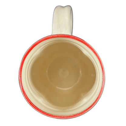 Top view of cream ceramic mug with red rim and handle, Rebecca Lowery embossed pottery mug ideal for coffee