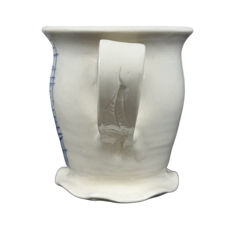 Vintage abstract blue lines pottery mug handmade ceramic with flared rim irregular base and curved handle on black background