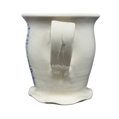 Vintage abstract blue lines pottery mug handmade ceramic with flared rim irregular base and curved handle on black background