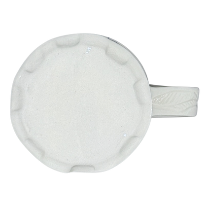 Vintage abstract blue lines pottery mug top view showing off white textured base and leaf handle