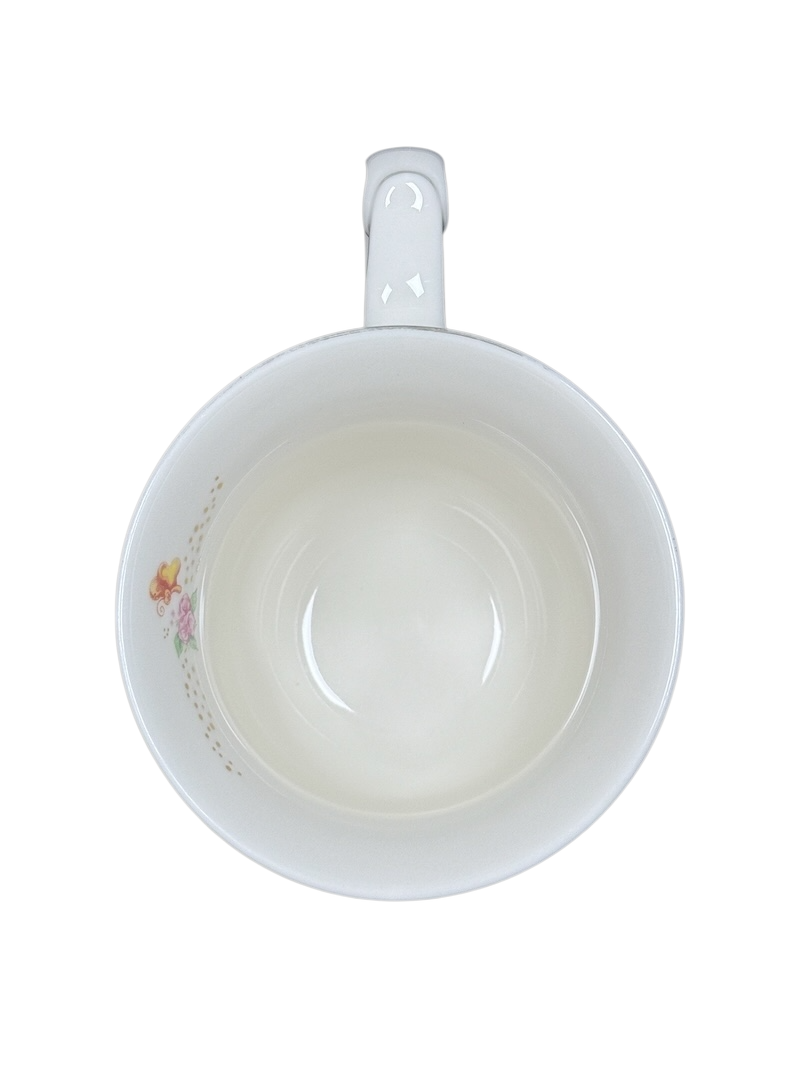 Disney Alice in Wonderland Mad Hatter vintage mug top view white interior with small floral decal near rim