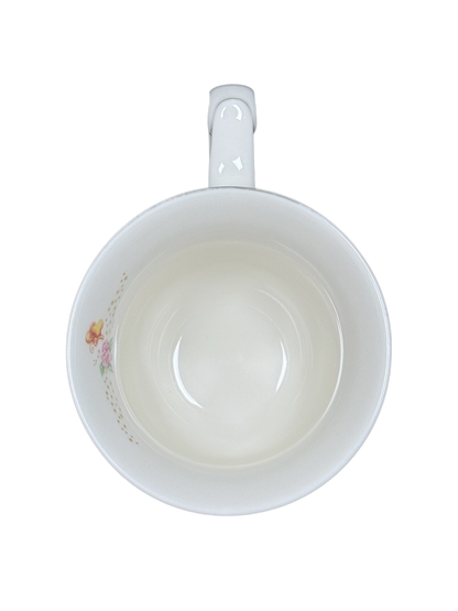 Disney Alice in Wonderland Mad Hatter vintage mug top view white interior with small floral decal near rim