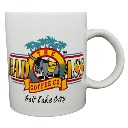 Bad Ass Coffee Company Salt Lake City mug featuring colorful logo and palm tree design