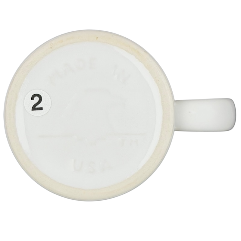 Bottom view of a vintage mug marked Made in USA, featuring Barack Obama birth certificate design