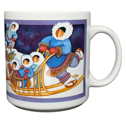 Barbara Lavallee Inuit family sledding mug featuring vibrant artwork of an Inuit family and sledding scene