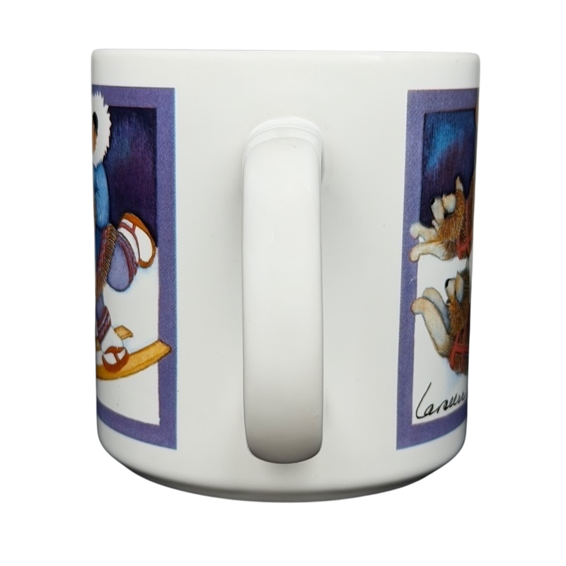 Barbara Lavallee Inuit family sledding mug featuring playful Inuit children and animals in vibrant colors