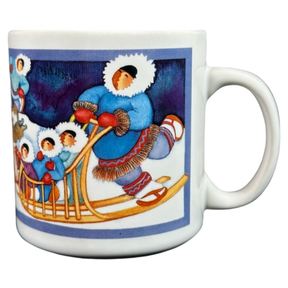Barbara Lavallee Inuit family sledding mug featuring colorful artwork of an Inuit family on a sled