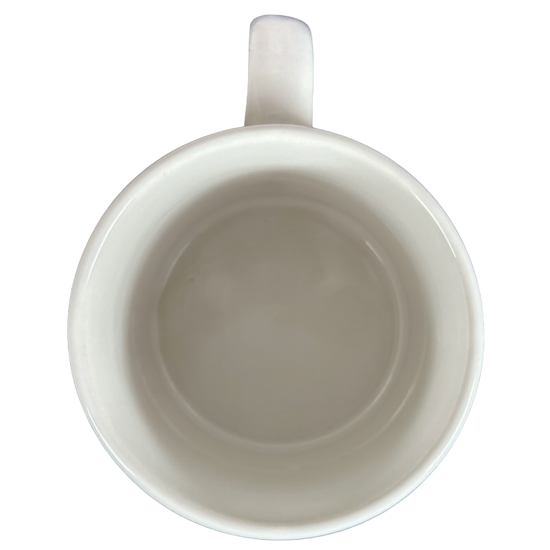 Top view of a white mug featuring Barbara Lavallee Inuit family sledding design for warm beverages