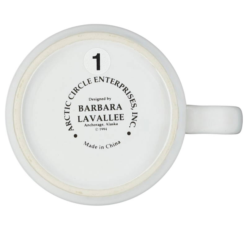 Bottom view of a Barbara Lavallee Inuit family sledding mug by Arctic Circle Enterprises
