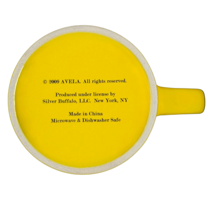 Bottom view of Beatles Yellow Submarine Mug Silver Buffalo featuring bright yellow color and care instructions