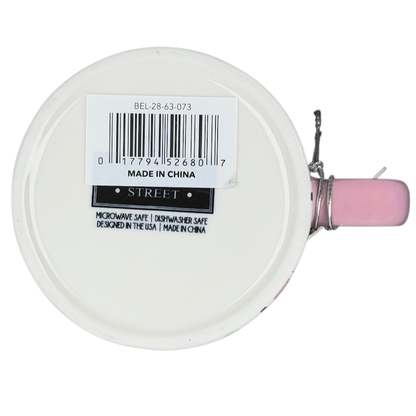 Bottom view of Bella dimpled wildflower mug with pink handle showing dishwasher safe tag