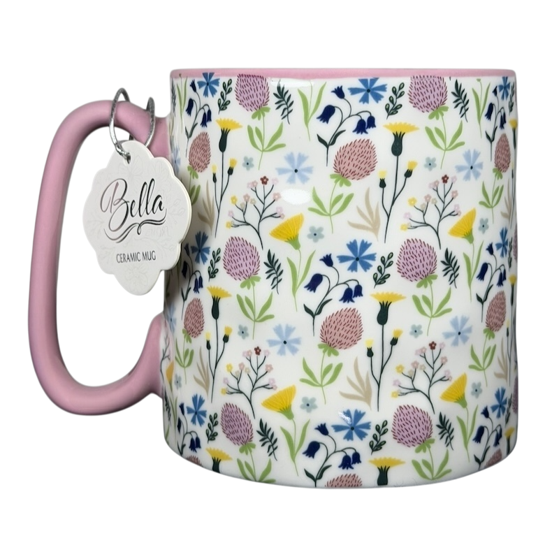 Bella dimpled wildflower mug with pink handle featuring colorful floral patterns on a white background