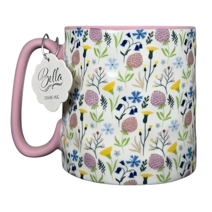 Bella dimpled wildflower mug with pink handle featuring colorful floral patterns on a white background