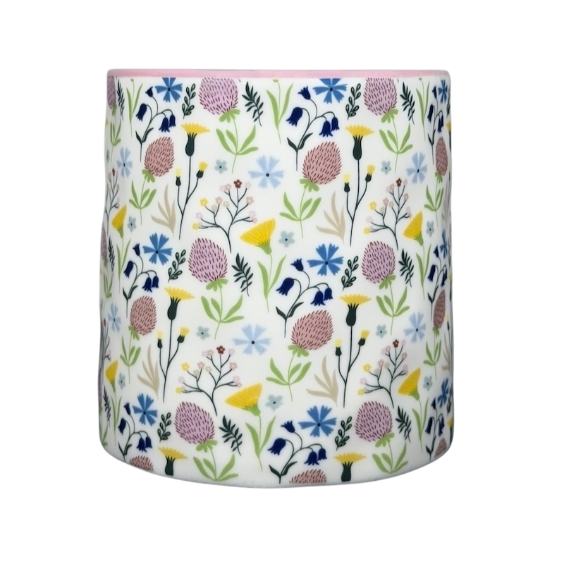 Bella dimpled wildflower mug with pink handle featuring colorful floral design on white ceramic