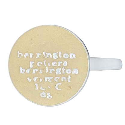 Top view of mug base with embossed Bennington Potters mark white handle Bennington Pottery Smithsonian vintage collectible mug
