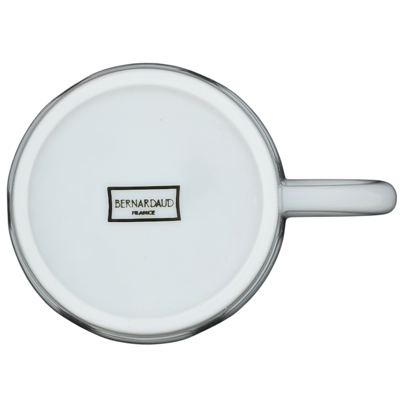 Bottom view of a white Limoges France Mug Bernardaud showcasing its elegant porcelain design