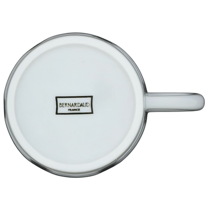 Bottom view of a white Limoges France Mug Bernardaud showcasing its elegant porcelain design